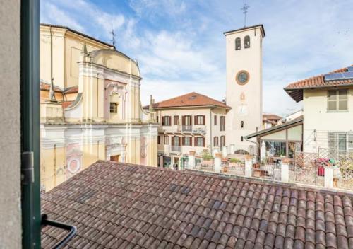 a view from a window of a building with a clock tower at La finestra dei Batù by Alterego in Villanova dʼAsti