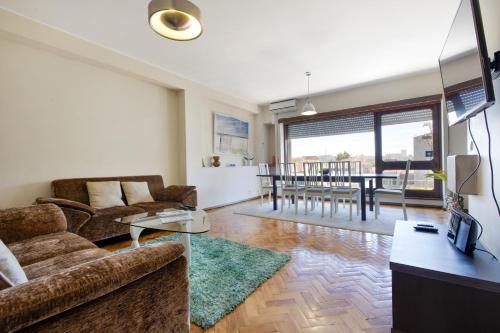 a living room with a couch and a table at LV Premier Apartments Clerigos-RE2 in Porto