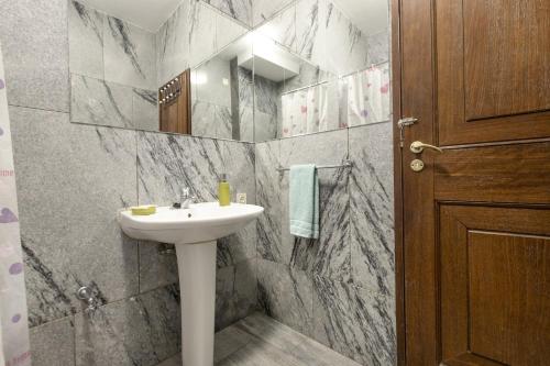 a bathroom with a sink and a mirror at LV Premier Apartments Clerigos-RE2 in Porto