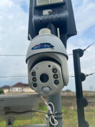 a security camera on top of a pole at De- Fmoapartments in Lagos