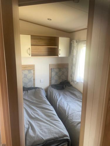 Ένα ή περισσότερα κρεβάτια σε δωμάτιο στο Oakleys lodge