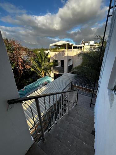 a balcony of a building with a swimming pool at Cozy and Rustic moments in Albion