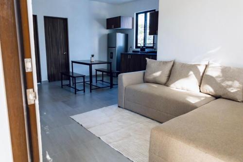 a living room with a couch and a table at Casa Ivanna Vallarta in Puerto Vallarta