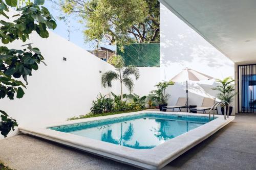 a swimming pool in the backyard of a house at Casa Ivanna Vallarta in Puerto Vallarta