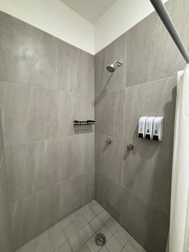 a bathroom with a shower with a shower curtain at Casa Ivanna Vallarta in Puerto Vallarta