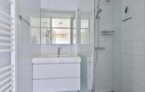 a white bathroom with a sink and a mirror at Stunning Home In Exloo With Wifi in Exloo