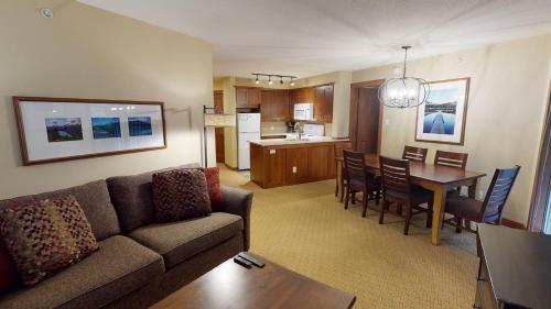 a living room and kitchen with a couch and a table at Horstman House by Whistler Premier in Whistler