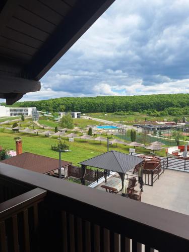 a balcony with a view of a park at Suzanne Băile Figa- camere hotel in Beclean