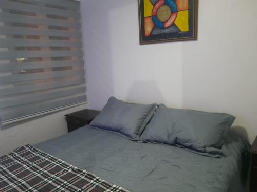 Postel nebo postele na pokoji v ubytování Departamento central