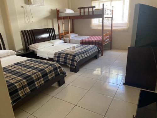 Ένα ή περισσότερα κρεβάτια σε δωμάτιο στο Hostal Terramar Salinas
