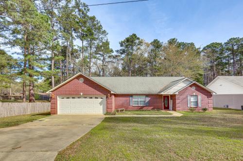 a red brick house with a white garage at 2 Mi to Downtown Work and Play at El Dorado Getaway in El Dorado