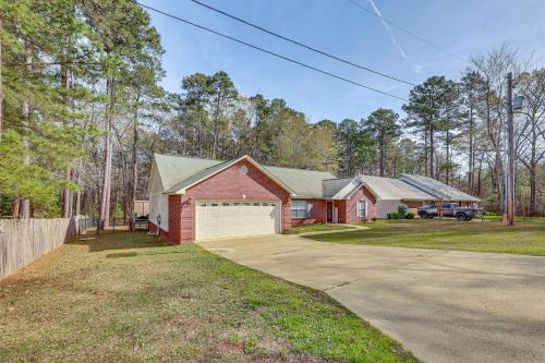 a red brick house with a white garage at 2 Mi to Downtown Work and Play at El Dorado Getaway in El Dorado