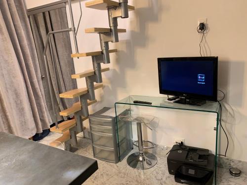 TV a/nebo společenská místnost v ubytování Monte-Carlo