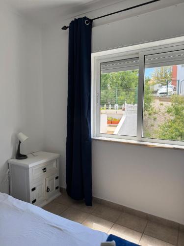 Ένα ή περισσότερα κρεβάτια σε δωμάτιο στο Azul Apartment