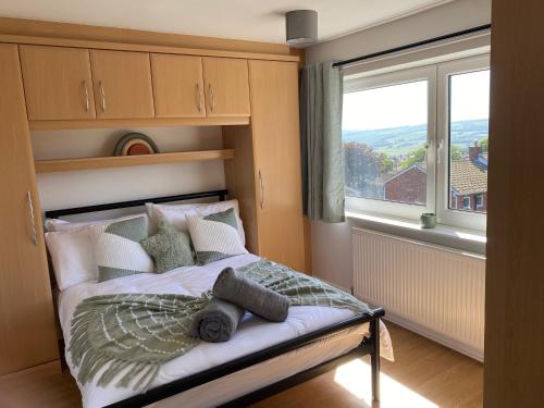 a bedroom with a bed with a large window at Easedale - 2 Bdrm Sleeps 4 Ideal for Contractors in Gateshead