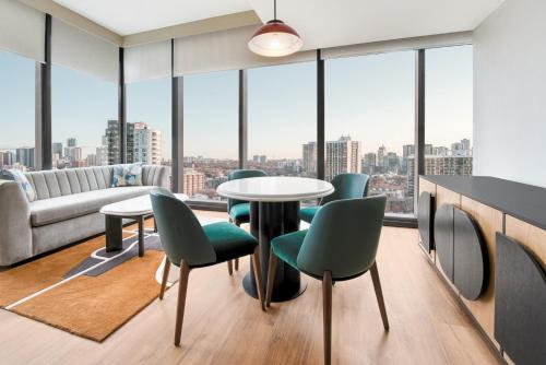 a room with a table and chairs and a large window at Toor Hotel Toronto, Part Of Jdv By Hyatt in Toronto