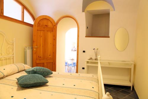 a bedroom with a bed and a fireplace at Le Terrazze di Cristina in Vietri sul Mare