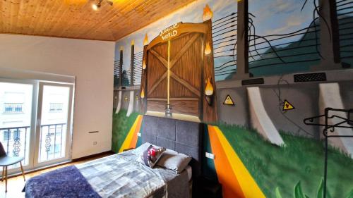 a bedroom with a mural of a baseball game at Apartamento Playa Catedrales & Piscina I in San Pedro de Benquerencia