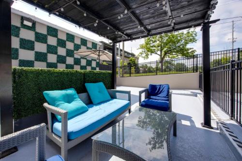 a patio with two chairs and a table at Best Western Downtown PLUS Music Row in Nashville
