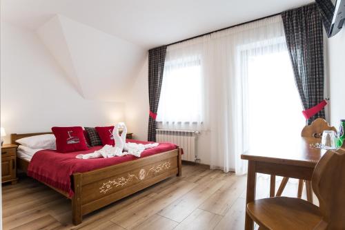 Postel nebo postele na pokoji v ubytování U Gawlaka - Noclegi z Jacuzzi i widokiem na Tatry