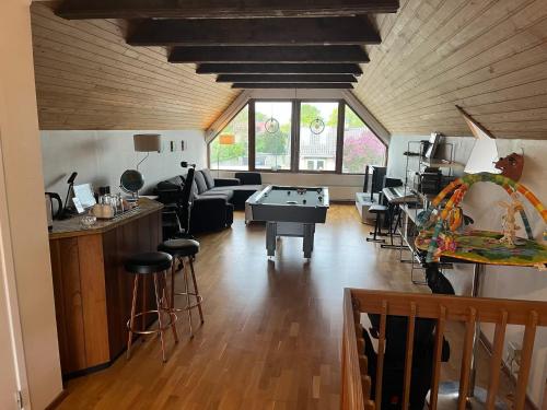 a living room with a ping pong table in it at Ocean Star Limhamn in Limhamn