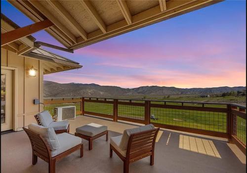 a patio with a view of the mountains at Desert Canyon Golf Resort in Orondo