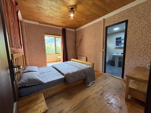 Postel nebo postele na pokoji v ubytování Guest House Shuan