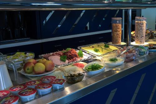 a buffet line with many different types of food at Central-Hotel Eberswalde in Eberswalde-Finow