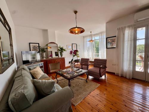 a living room with a couch and a table at Liberty House - Central Two Bedroom Apartments in Nicosia