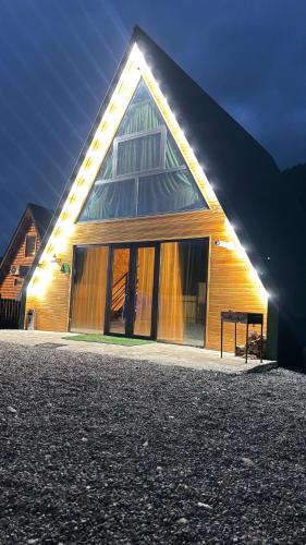 a large building with a light on the side of it at Wood cottage in Borjomi in Borjomi