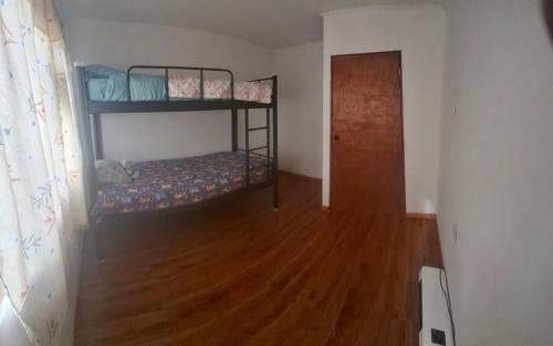 Ένα ή περισσότερα κρεβάτια σε δωμάτιο στο Amplia Casa Familiar huaquen la ligua
