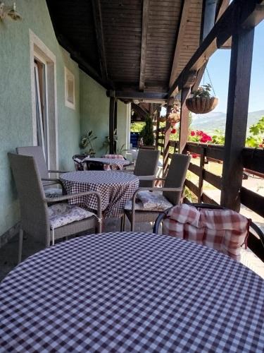 a checkered table and chairs on a patio at Privatan smeštaj Velić in Donji Milanovac