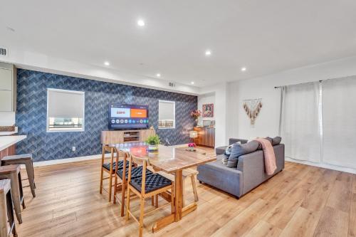 a living room with a table and a couch at Luxurious Townhome W/3 Master Suites gated Parking in Los Angeles