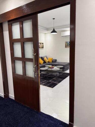 a door leading into a living room with a couch at Hala Home in Quai