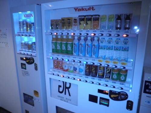 a vending machine filled with lots of bottles of water at Green Rich Hotel Nishitetsu Ohashi Ekimae in Fukuoka