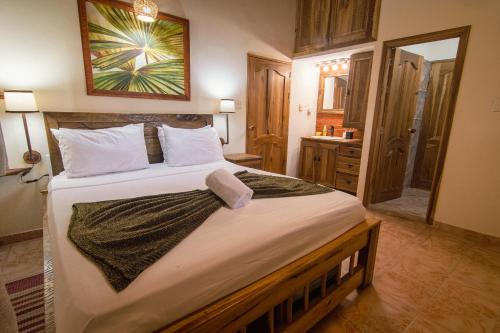 a bedroom with a large bed in a room at Tayrona Farm House Sleep 15 AC Breakfast included in Buritaca