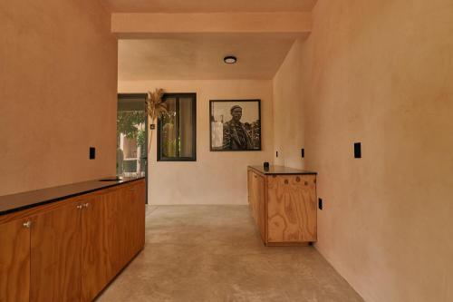 a hallway of a house with wooden cabinets at Pan Beach in Brisas de Zicatela