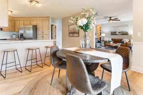 a kitchen and living room with a table and chairs at Newly Renovated Lake Bowen Home with Game Room! in Campobello