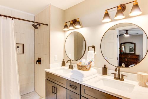 a bathroom with a sink and a shower and a mirror at Newly Renovated Lake Bowen Home with Game Room! in Campobello