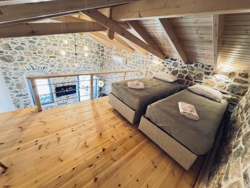 En eller flere senge i et værelse på Kenezakia houses