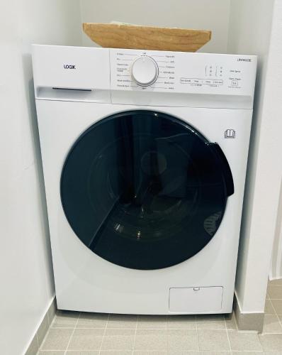 a white washer and dryer in a kitchen at Nuuk Stay in Nuuk
