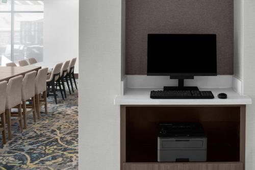a computer sitting on a desk in a conference room at Residence Inn Salt Lake City Murray in Murray