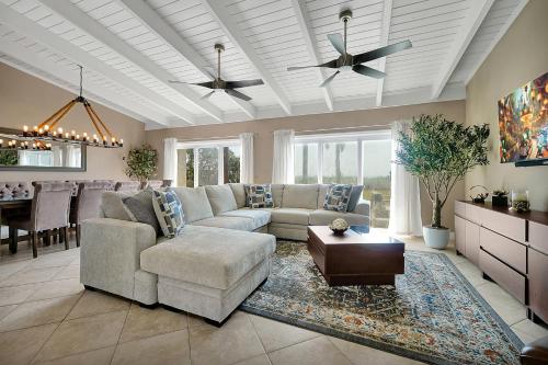 a living room with a couch and a table at Villa with Beach Front Views in Cocoa Beach