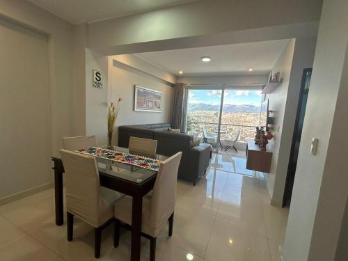 a living room with a table and a dining room at Hotel La Libertad - Ayacucho in Ayacucho