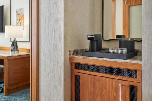a hotel room with a coffee maker on a counter at JW Marriott Austin in Austin