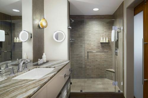 a bathroom with a sink and a shower at JW Marriott Austin in Austin