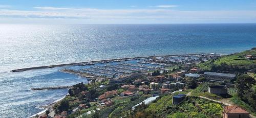 an aerial view of a small town next to the ocean at VistaBlu Bussana in Arma di Taggia