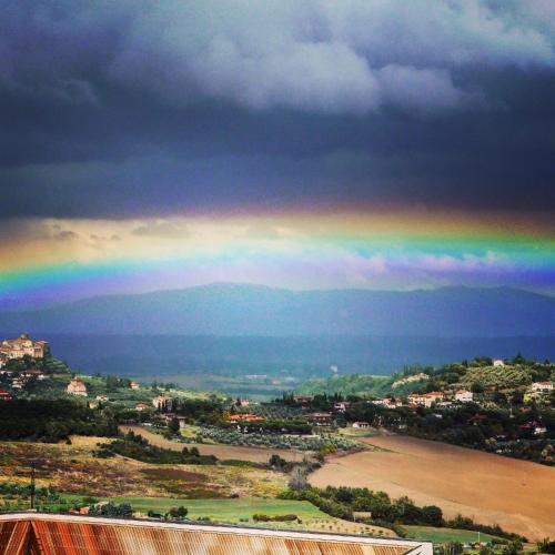 a rainbow in the sky over a beach at Hotel Del Buono Wellness & Medical Spa in Chianciano Terme