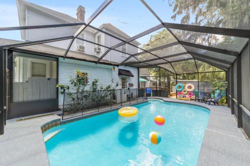 a swimming pool with an arcade over it at Martin B- historic district apt with pool in Ocala