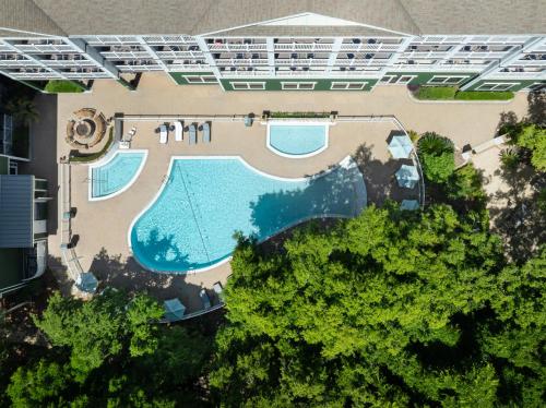 an overhead view of a swimming pool with trees at Hampton Inn & Suites Jekyll Island in Jekyll Island